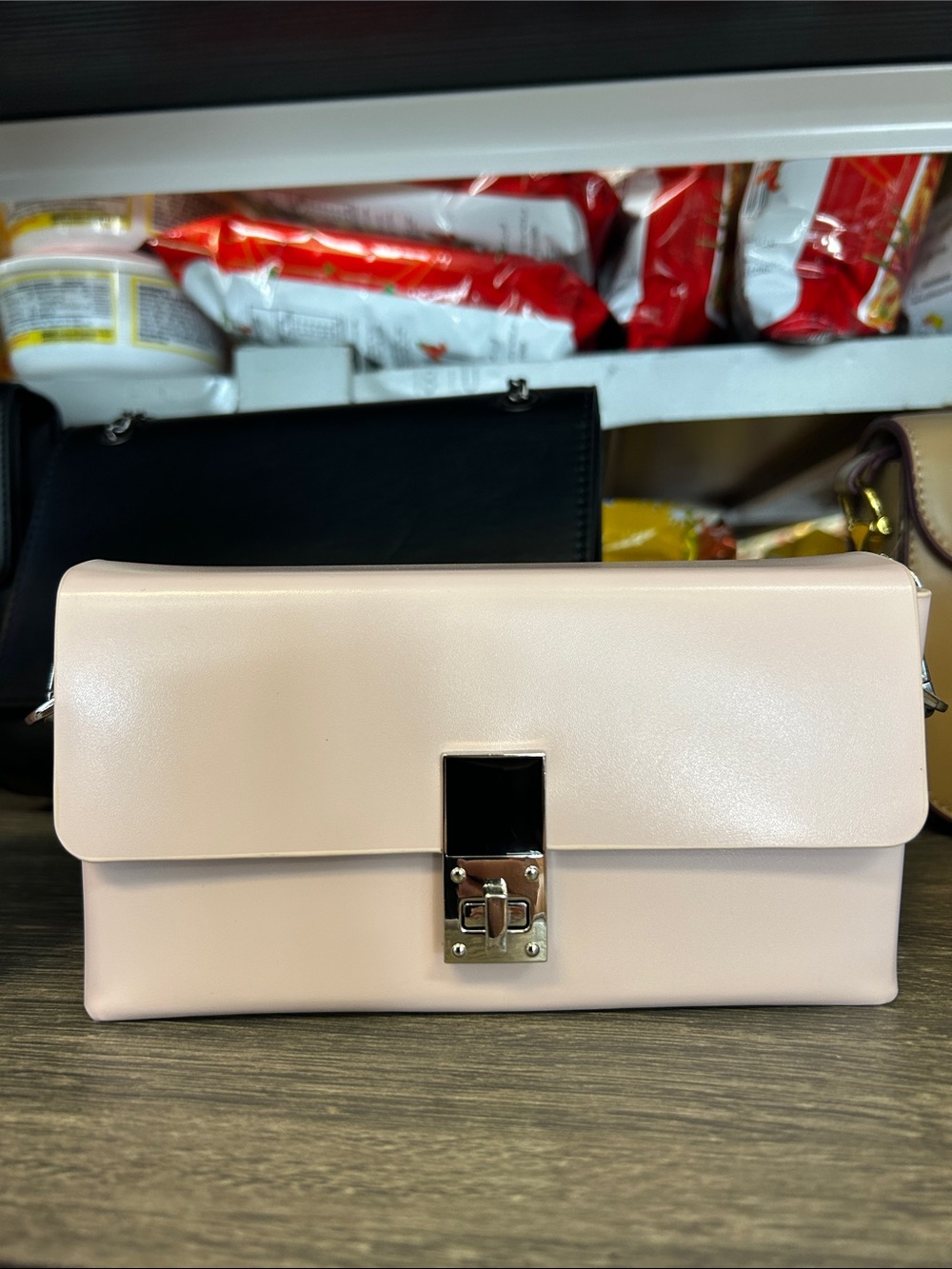 Elegant Blush Leather Crossbody Clutch with Silver Lock